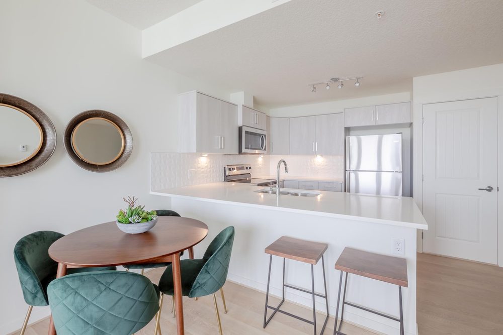 Kitchen with an island and a round dining table