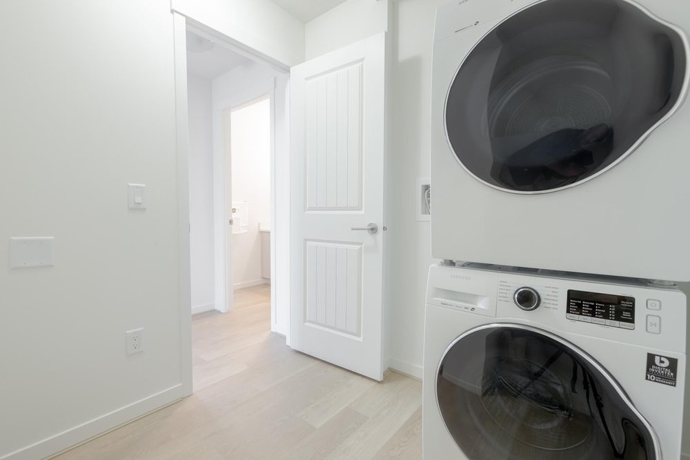 In-suite stacked washer and dryer