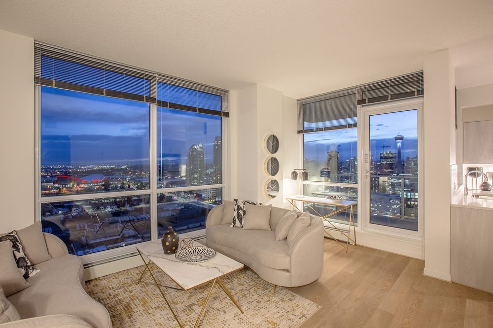 Living room at dusk with city lights