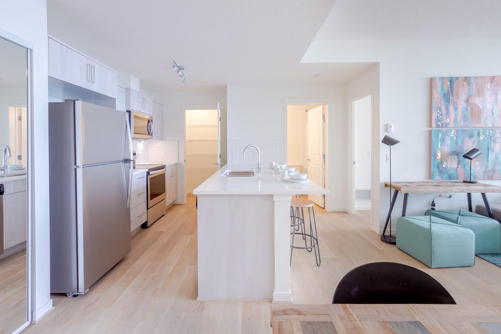 Kitchen and living area with stainless appliances