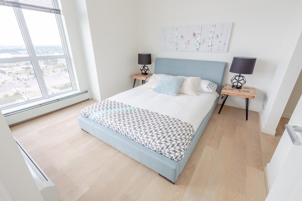 Bedroom with a window over the city
