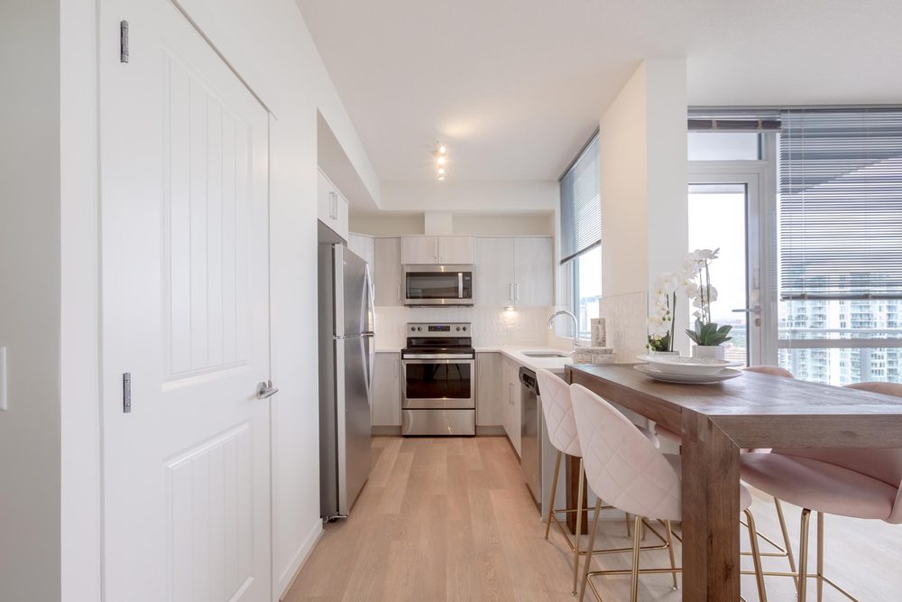 Kitchen with stainless appliances and a dining bar