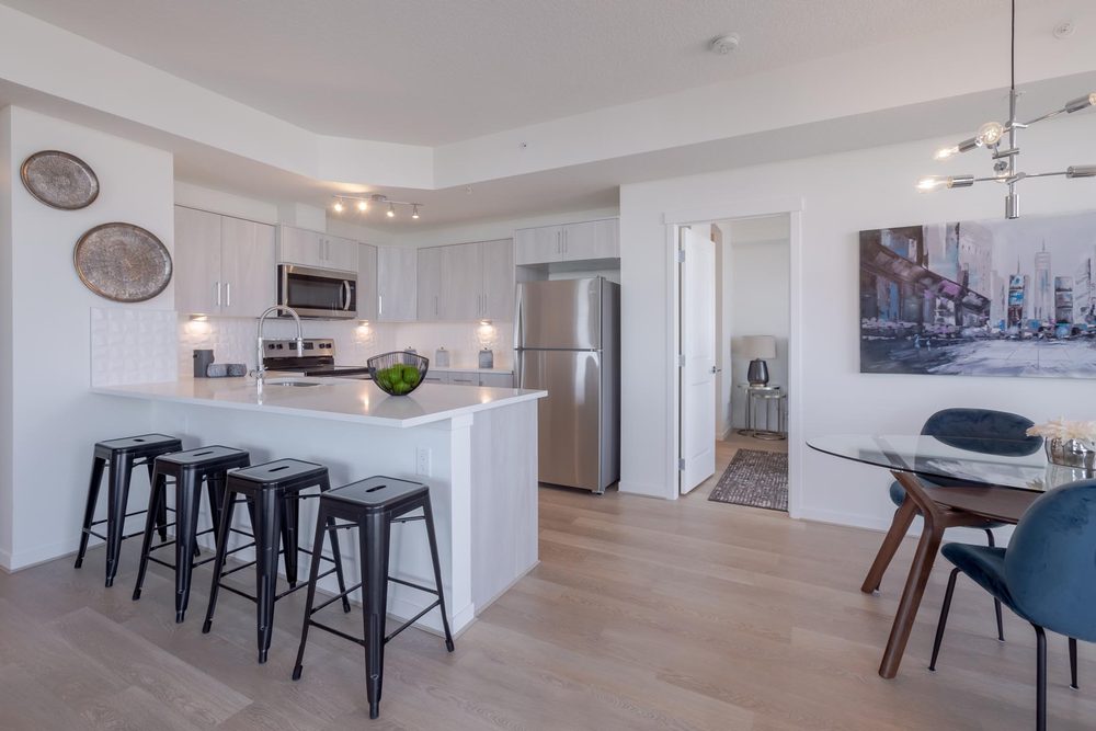 Kitchen island with stools and a dining area