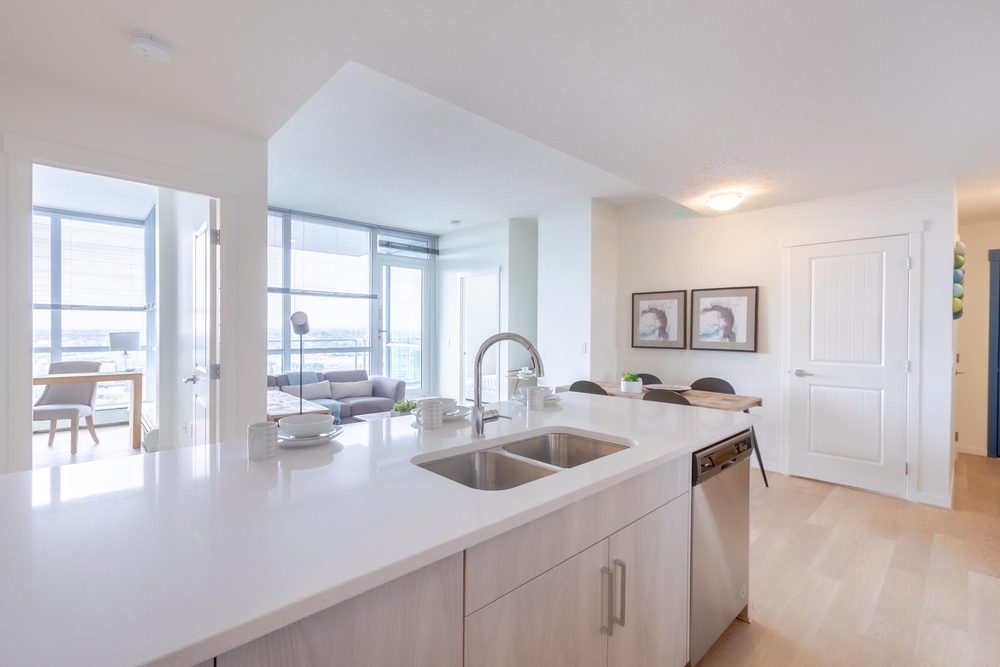 Kitchen sink at the island, looking into the living room