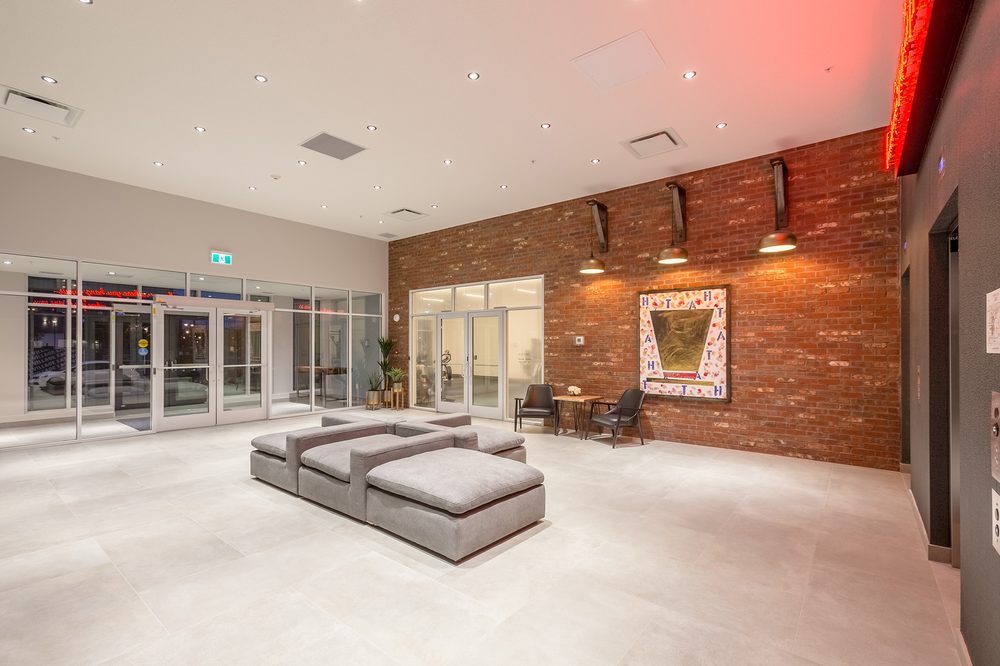 Main floor lobby with brick feature wall