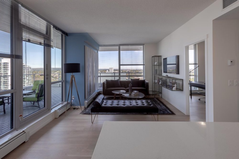 Corner living room with floor-to-ceiling windows