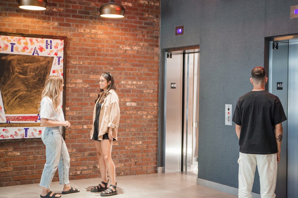 Residents in the lobby by the elevators
